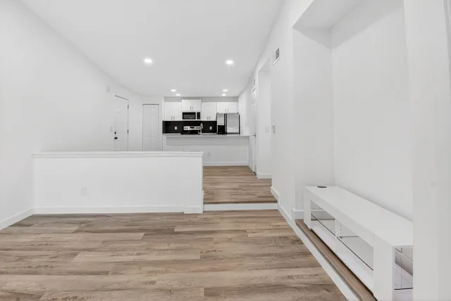 a view of kitchen with microwave and stove