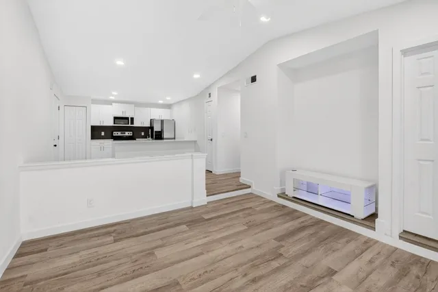 a view of entryway with wooden floor