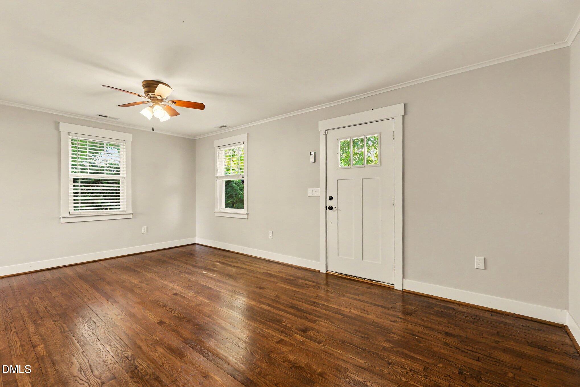 2111 Milburnie Road Raleigh, NC 27610 - Photo 3 of 27 Living room with hardwood floors and ceiling fan