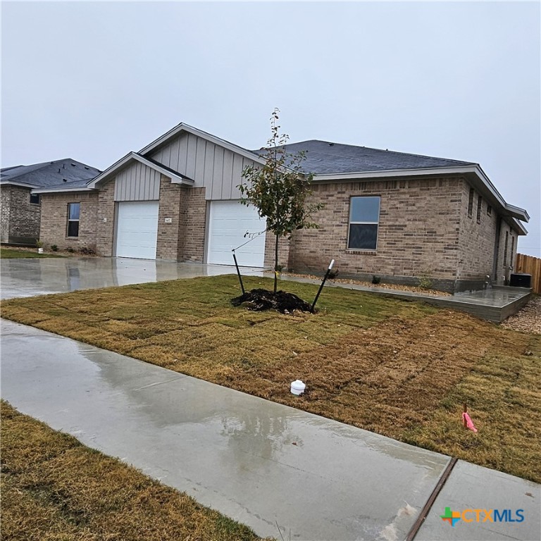 5405 Rose Gdn Loop Killeen, TX 76542 - Photo 1 of 16 a backyard of a house with table and chairs