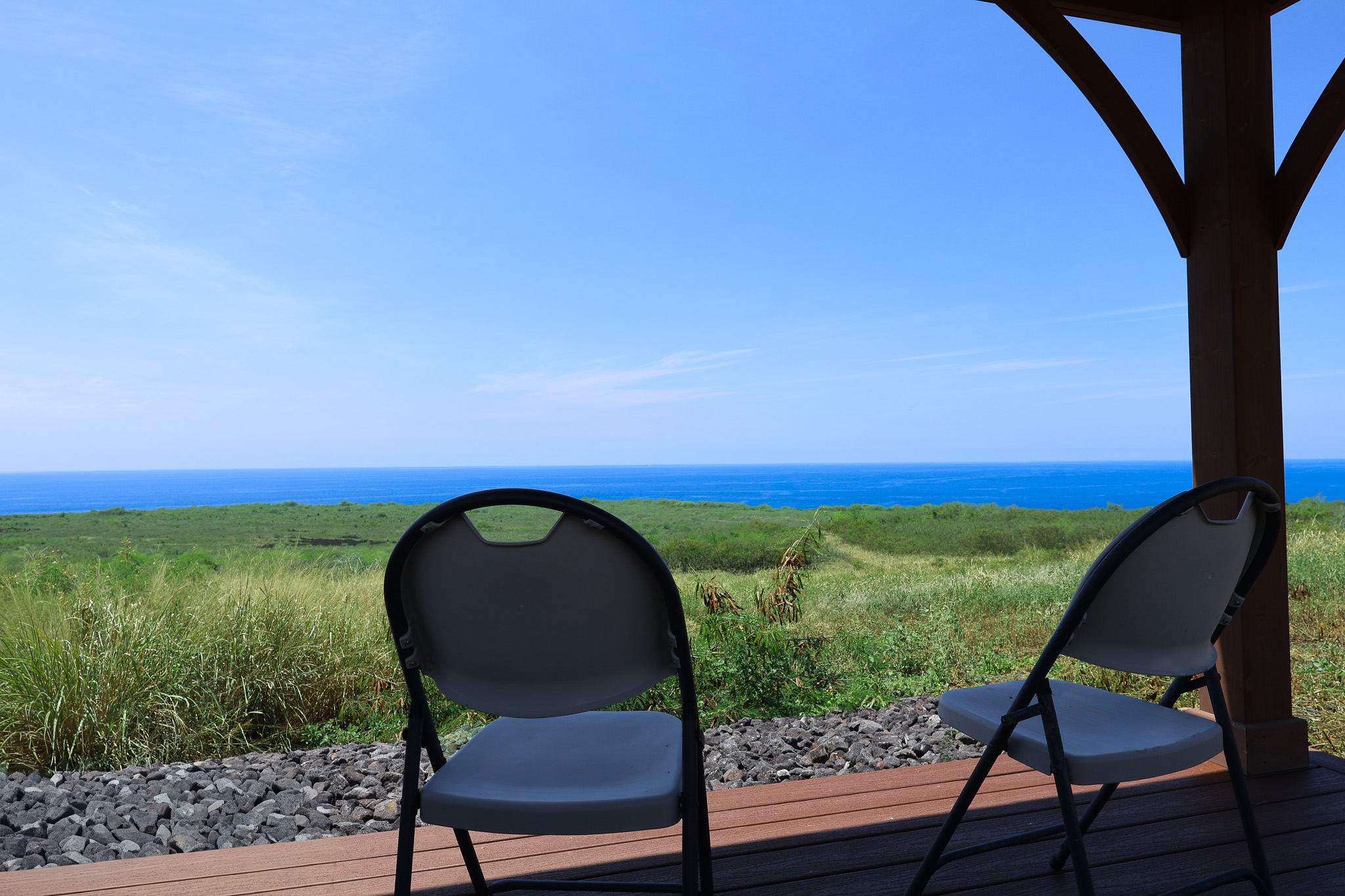 85-4471 Kapia Road Captain Cook, HI 96704 - Photo 17 of 30 a backyard of a house with wooden floor and outdoor seating