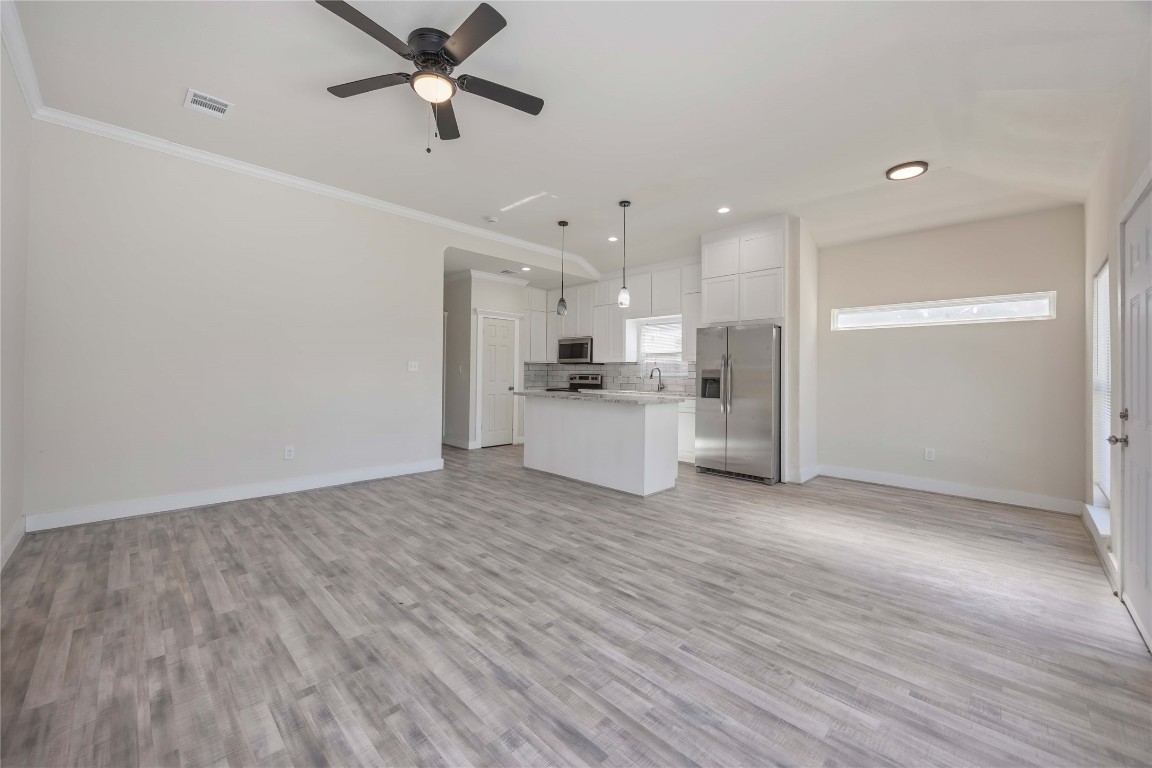 2708 Sam Wilson Street Houston, TX 77020 - Photo 17 of 18 a view of a kitchen with a sink and a refrigerator