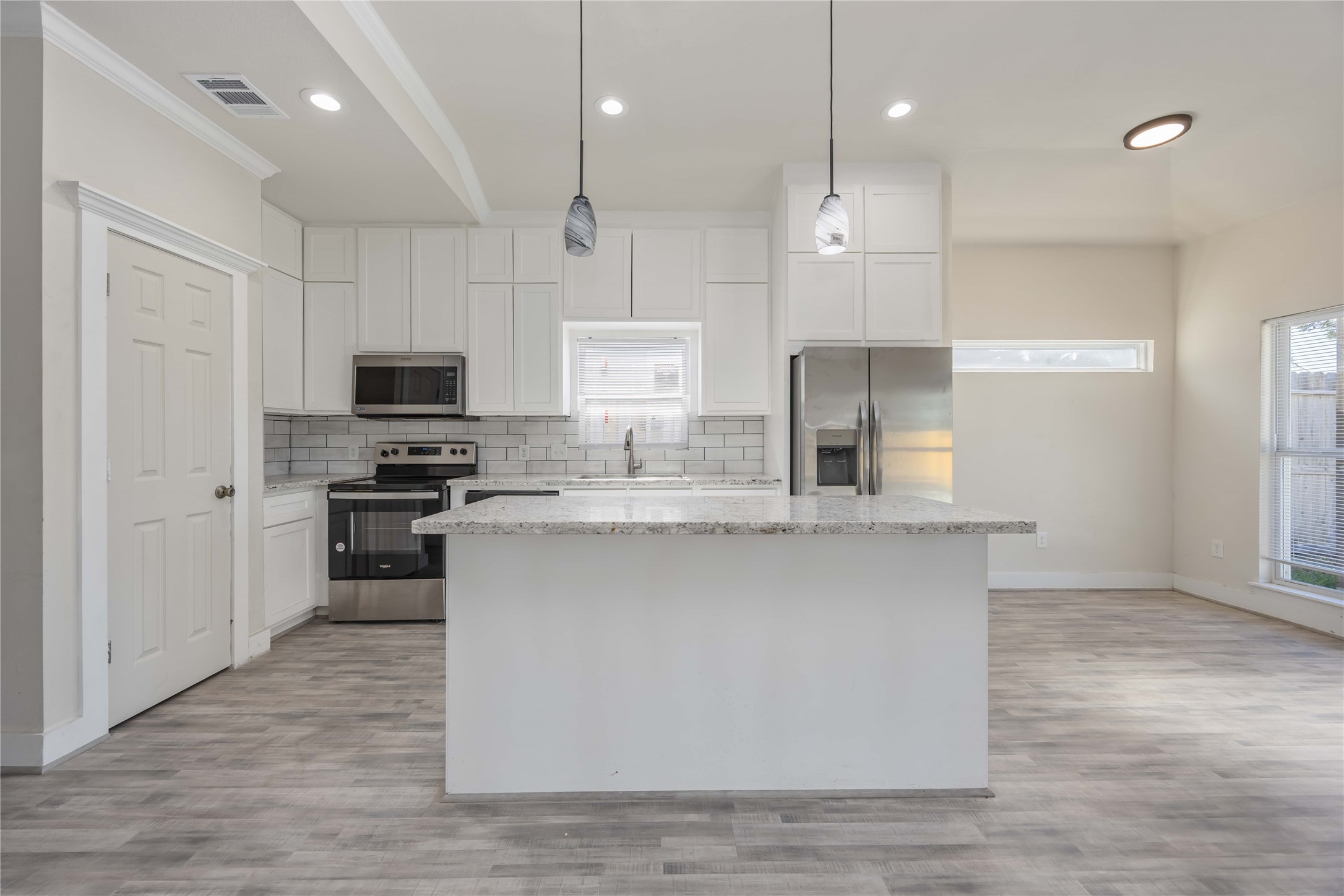 2708 Sam Wilson Street Houston, TX 77020 - Photo 5 of 18 a kitchen with kitchen island a sink stainless steel appliances and cabinets