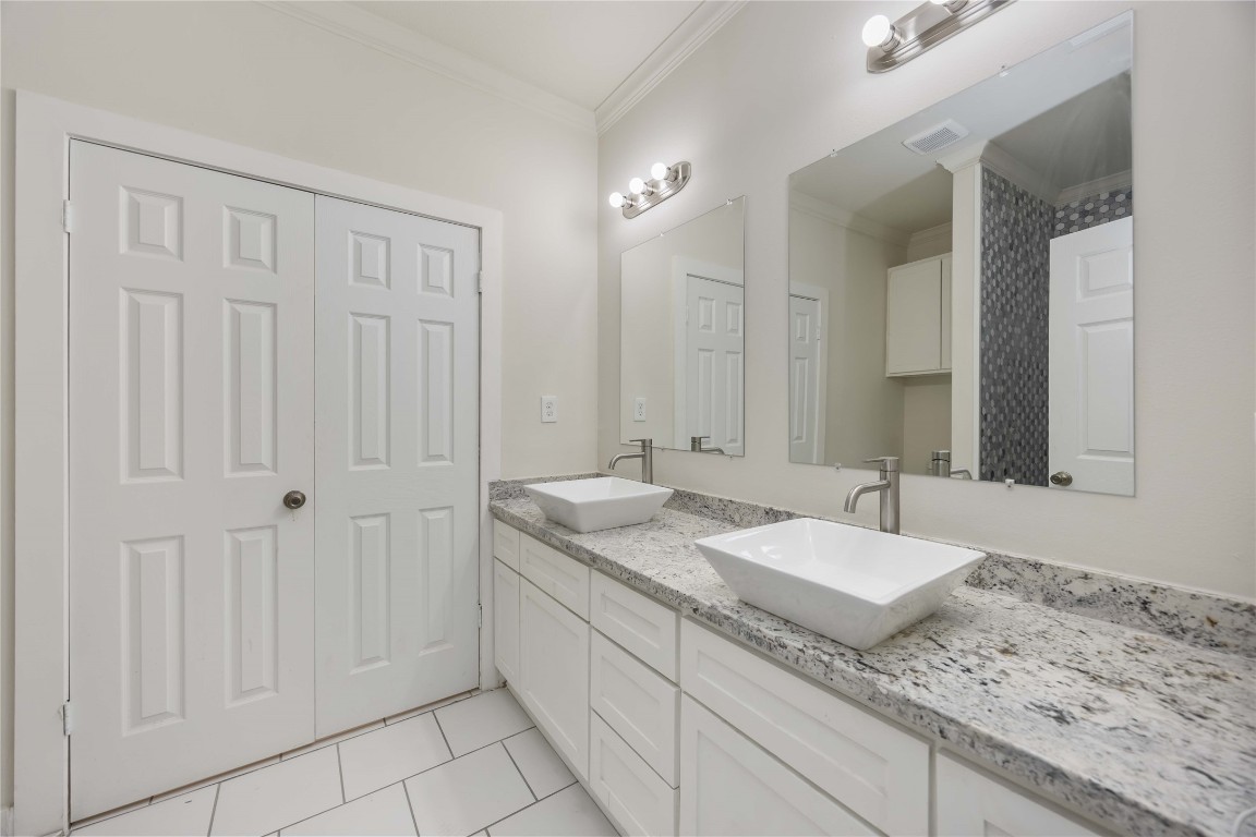 2708 Sam Wilson Street Houston, TX 77020 - Photo 8 of 18 a bathroom with a granite countertop sink and a mirror