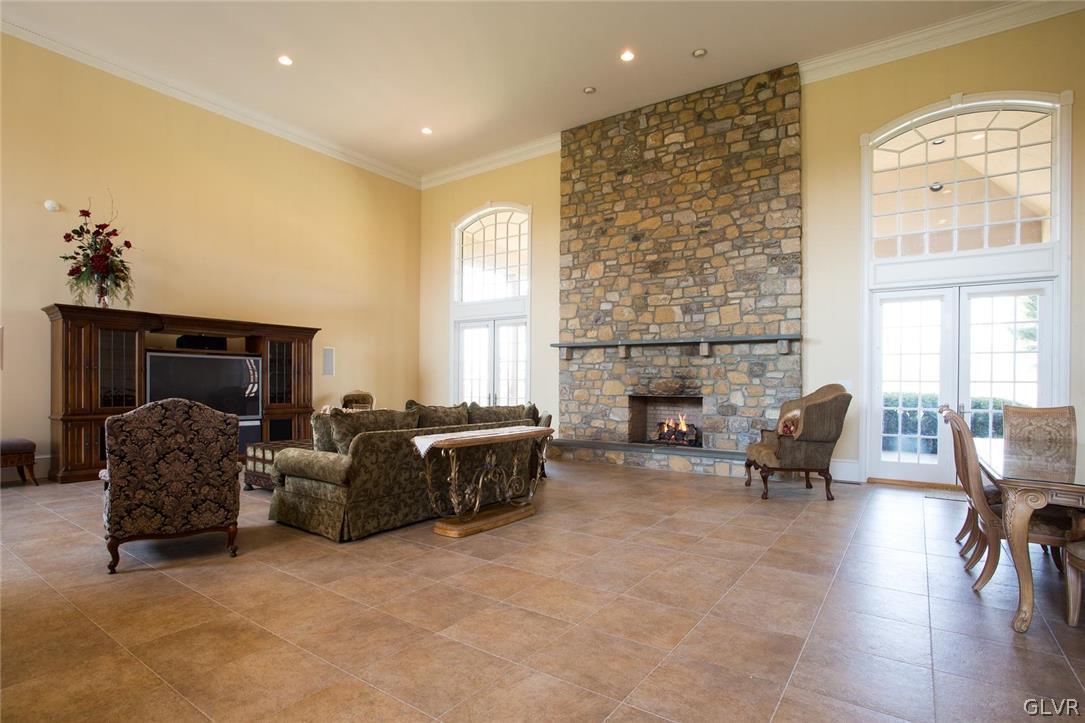 433 Little Creek Drive Nazareth, PA 18064 - Photo 2 of 44 a living room with furniture and a fireplace