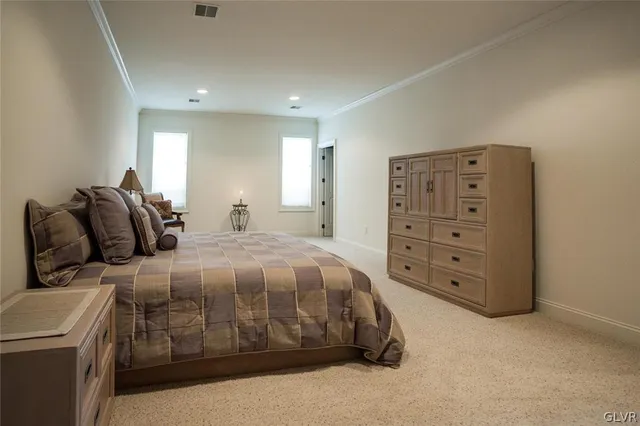 a bedroom with a bed and a cabinets