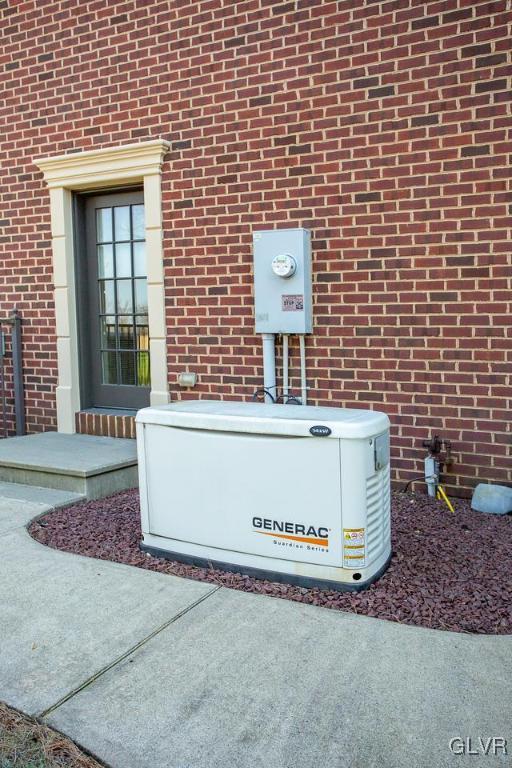 433 Little Creek Drive Nazareth, PA 18064 - Photo 31 of 44 a view of a brick house with a bench