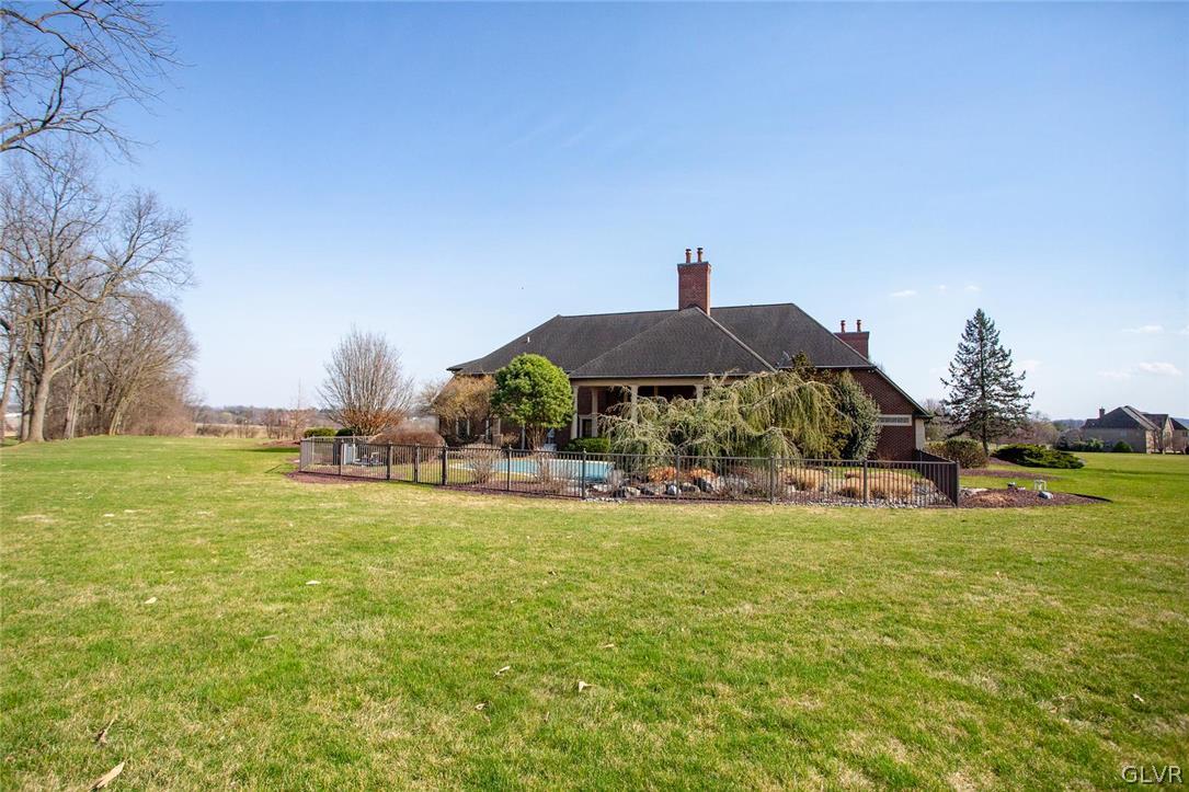 433 Little Creek Drive Nazareth, PA 18064 - Photo 35 of 44 a view of a swimming pool and lounge chairs in the patio