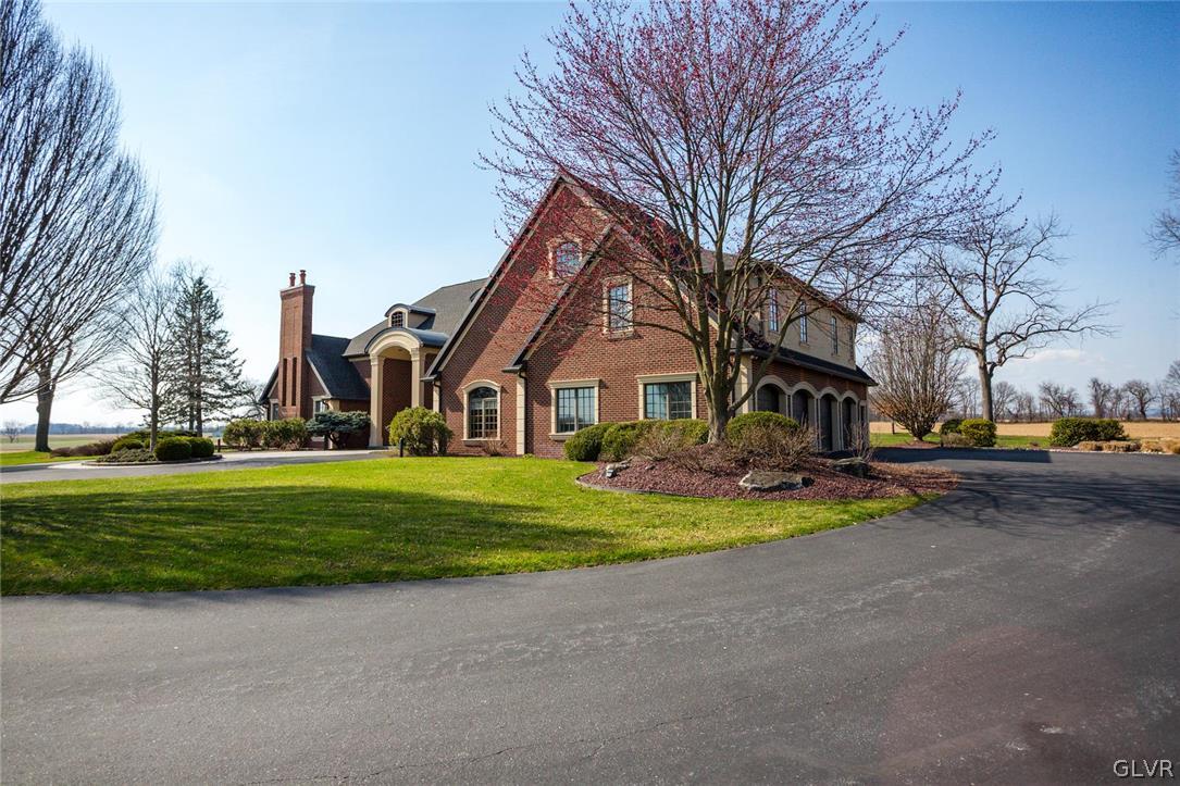 433 Little Creek Drive Nazareth, PA 18064 - Photo 37 of 44 a front view of a house with a yard and garage