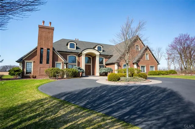 a front view of the house with garden