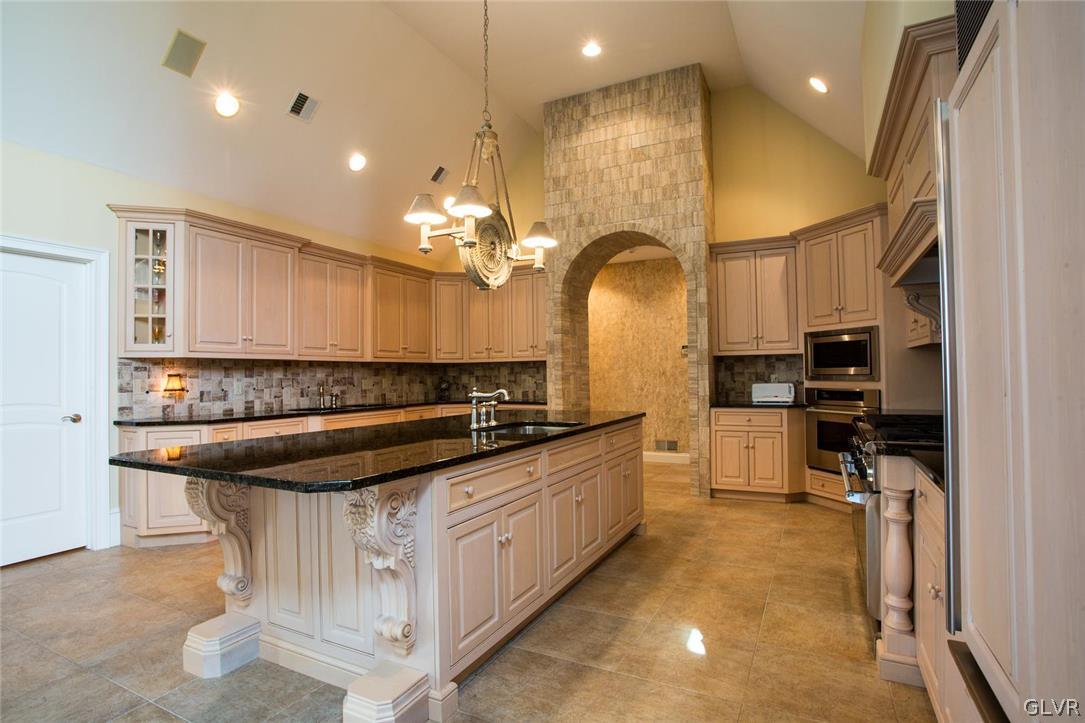 433 Little Creek Drive Nazareth, PA 18064 - Photo 5 of 44 a kitchen with stainless steel appliances granite countertop a sink and cabinets