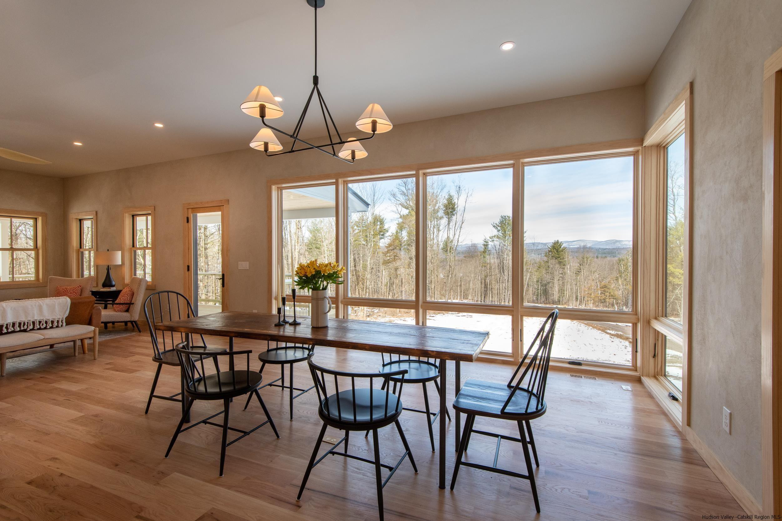 1622 Berme Road Kerhonkson, NY 12446 - Photo 12 of 33 a view of a dining room with furniture window and wooden floor