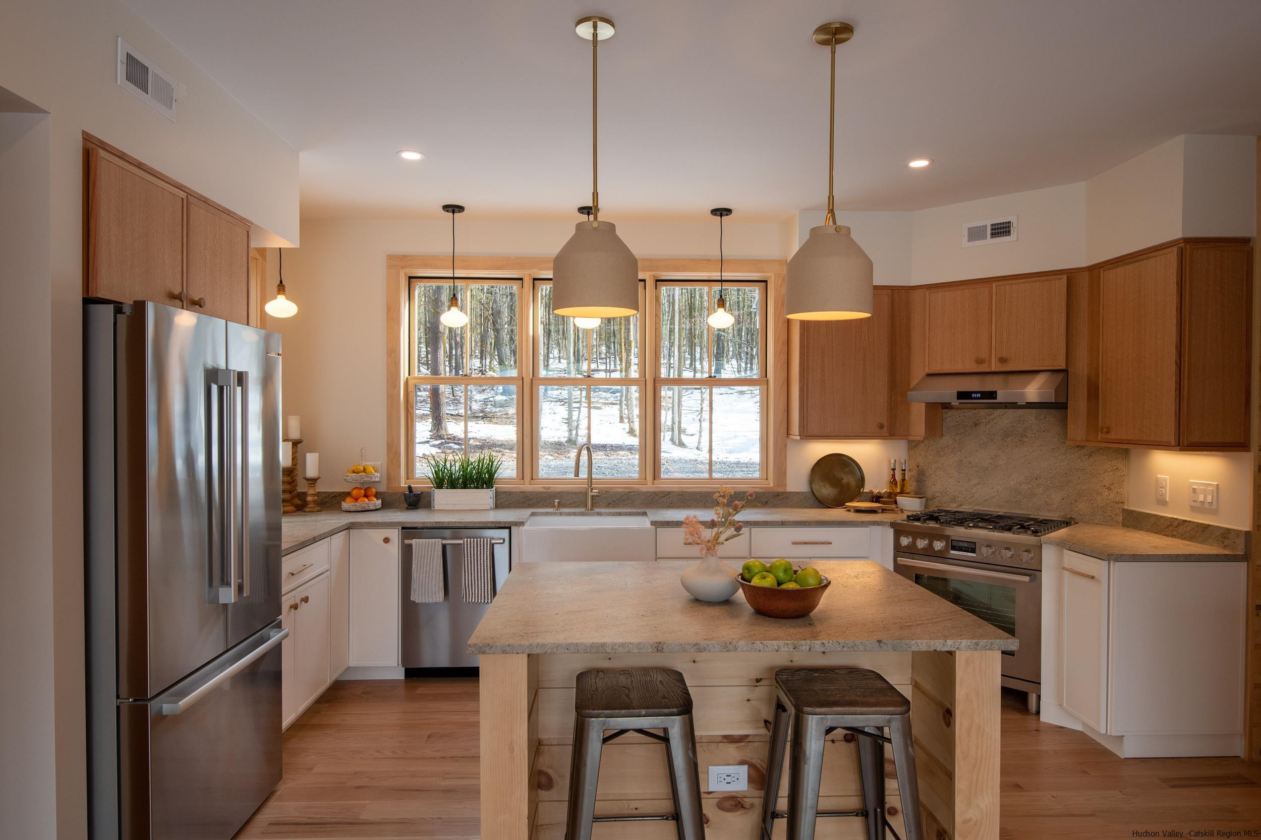 1622 Berme Road Kerhonkson, NY 12446 - Photo 14 of 33 a kitchen with sink a refrigerator and chairs
