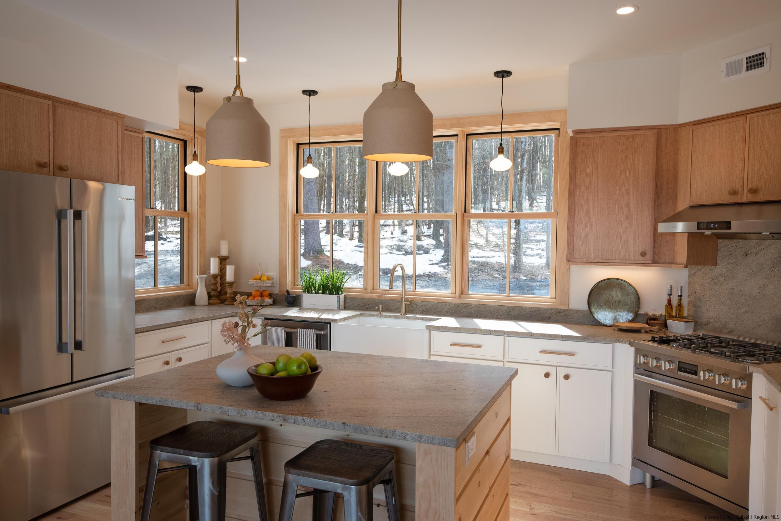 1622 Berme Road Kerhonkson, NY 12446 - Photo 15 of 33 a kitchen with a sink a stove and chairs
