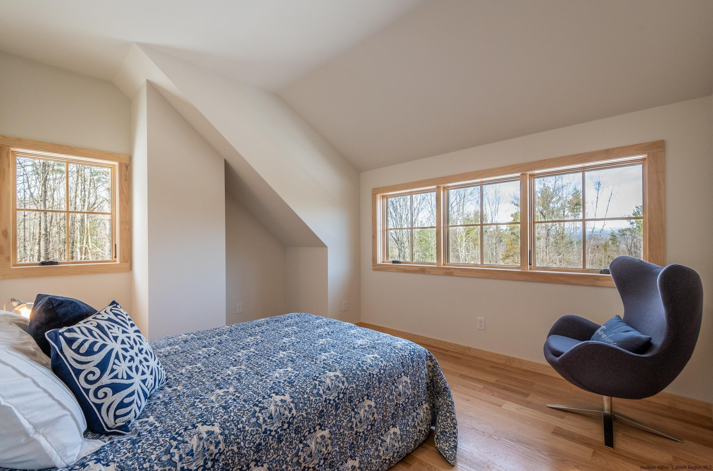 1622 Berme Road Kerhonkson, NY 12446 - Photo 27 of 33 a bedroom with a bed and wooden floor