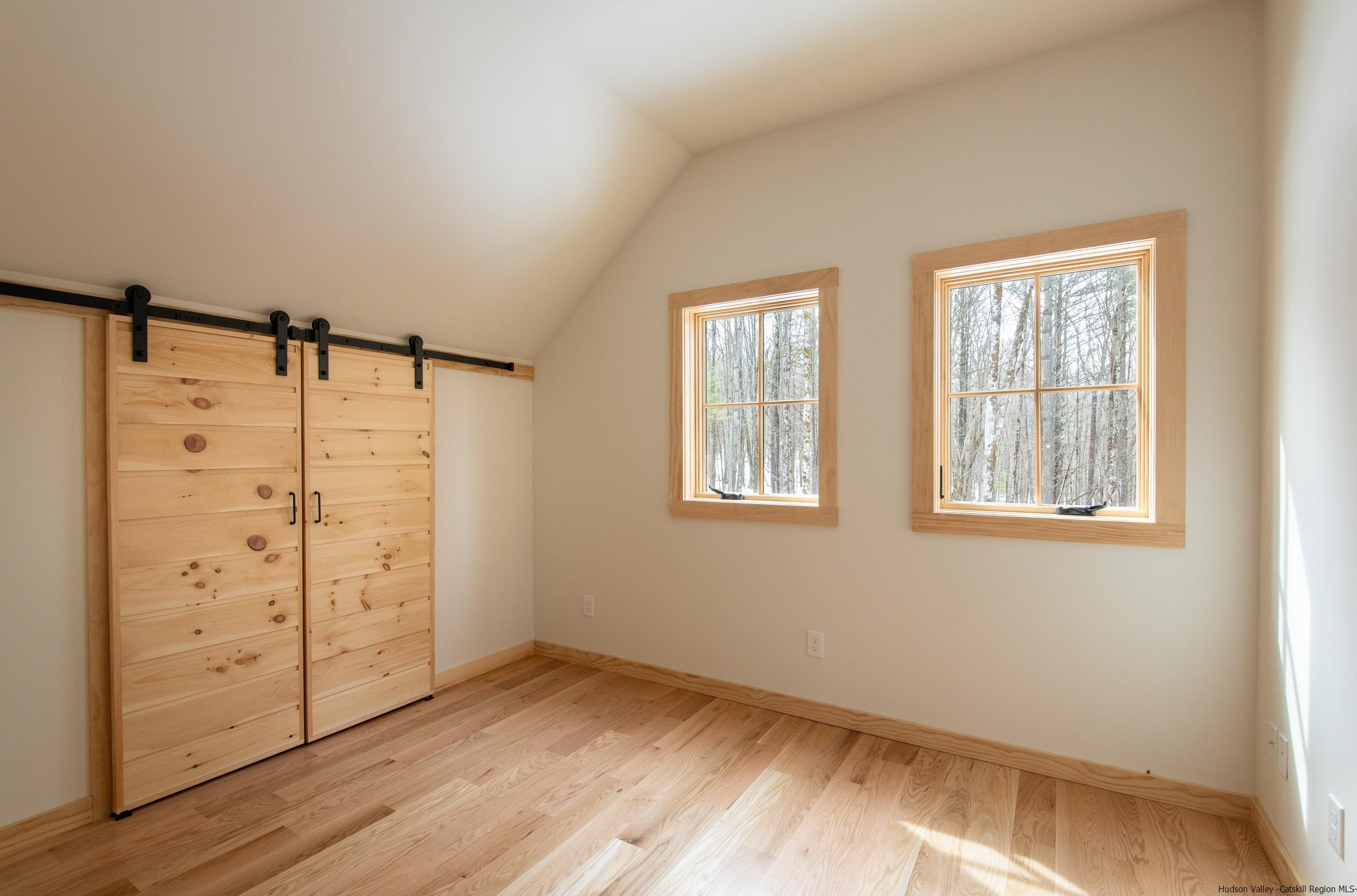 1622 Berme Road Kerhonkson, NY 12446 - Photo 28 of 33 a view of a room with wooden floor closet and windows