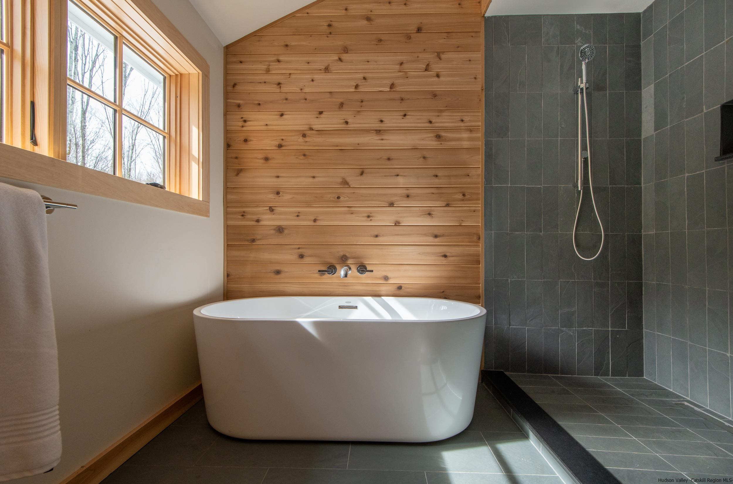 1622 Berme Road Kerhonkson, NY 12446 - Photo 30 of 33 a white bath tub sitting in a bathroom