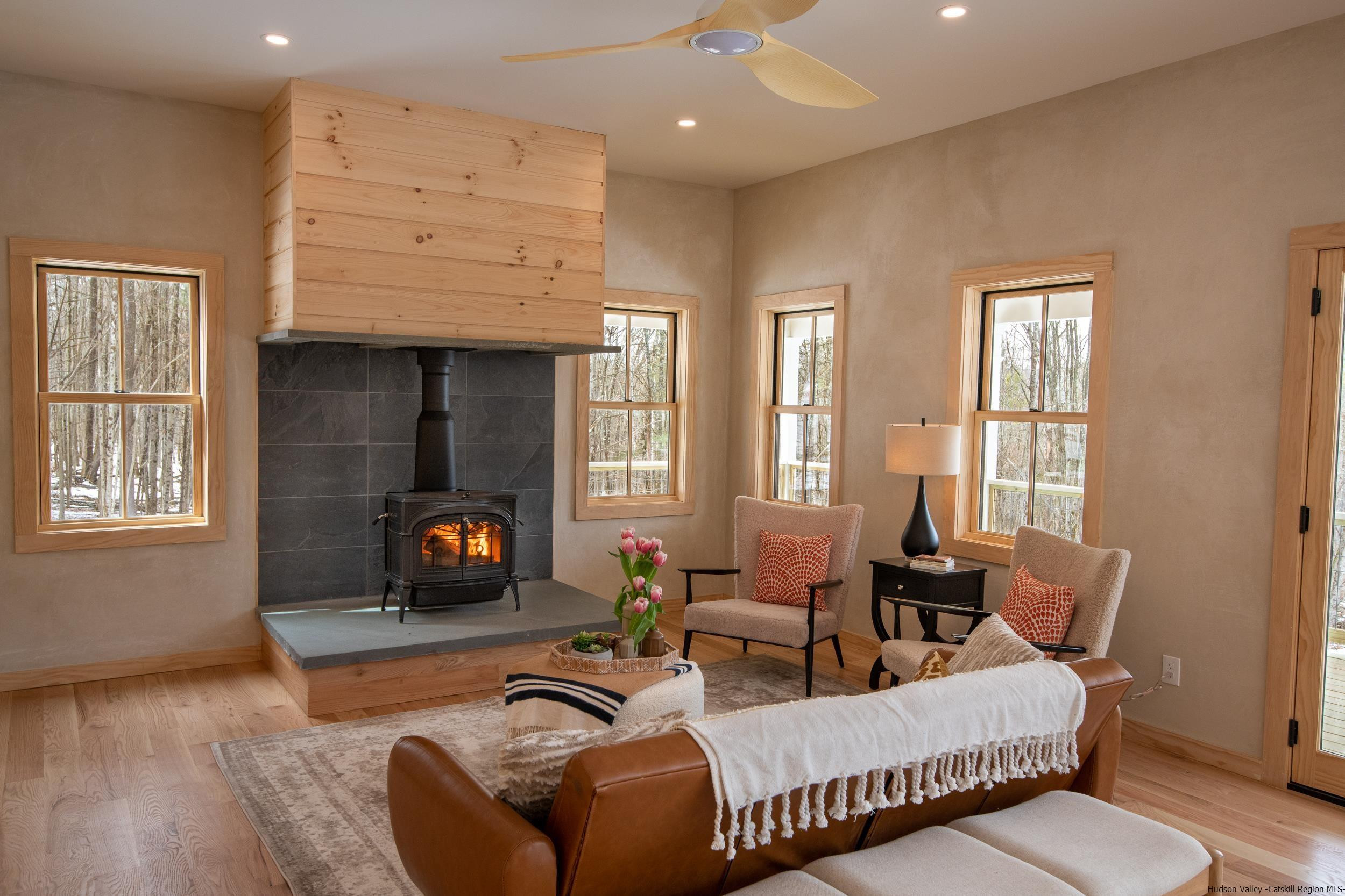 1622 Berme Road Kerhonkson, NY 12446 - Photo 5 of 33 a living room with furniture and a fireplace