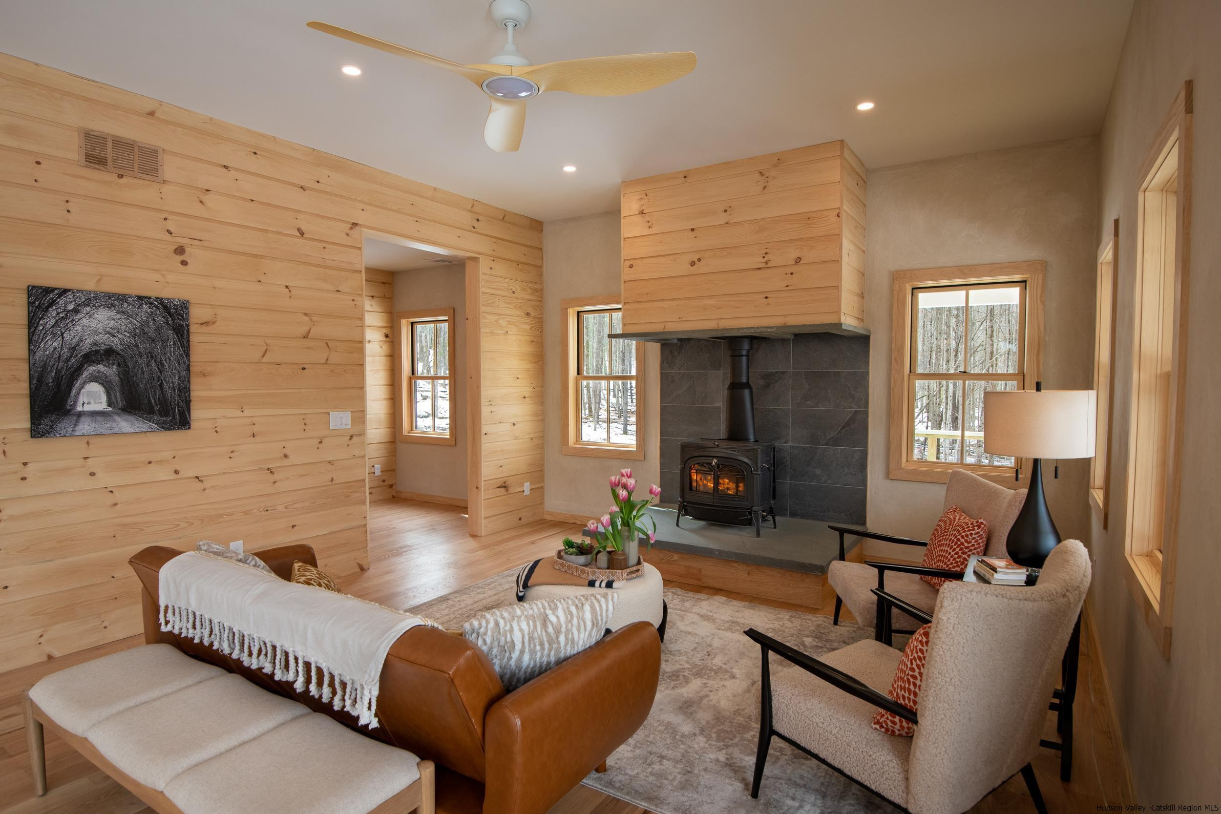 1622 Berme Road Kerhonkson, NY 12446 - Photo 6 of 33 a living room with furniture and a fireplace