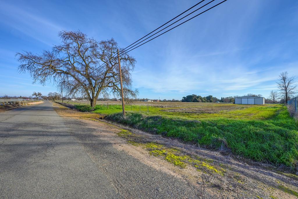 3333 Nicolaus Road Lincoln, CA 95648 - Photo 6 of 13 Entrance road to property is at this end of the land with easy drive up to Shop.