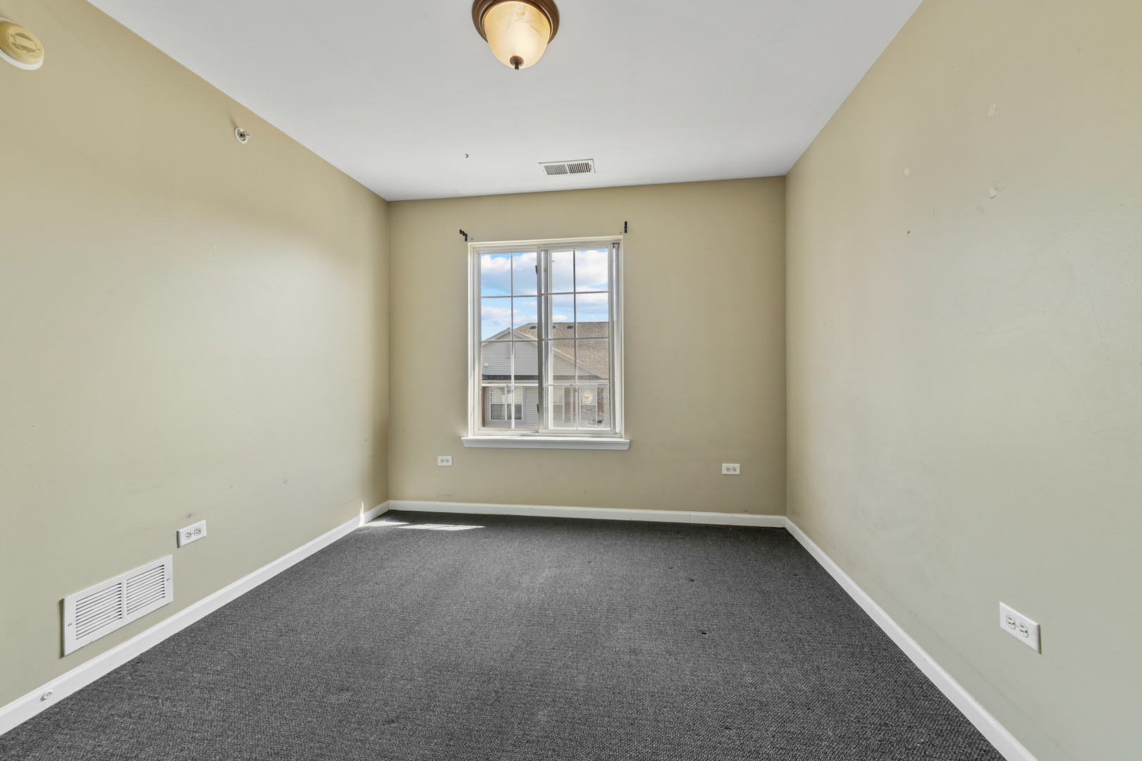 10233 Concord Lane, Unit C Bridgeview, IL 60455 - Photo 11 of 20 an empty room with a window
