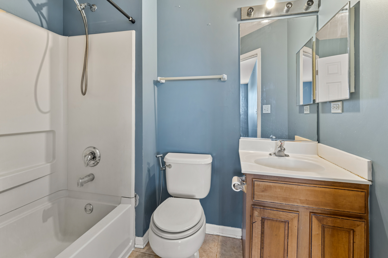 10233 Concord Lane, Unit C Bridgeview, IL 60455 - Photo 14 of 20 a bathroom with a sink toilet and shower