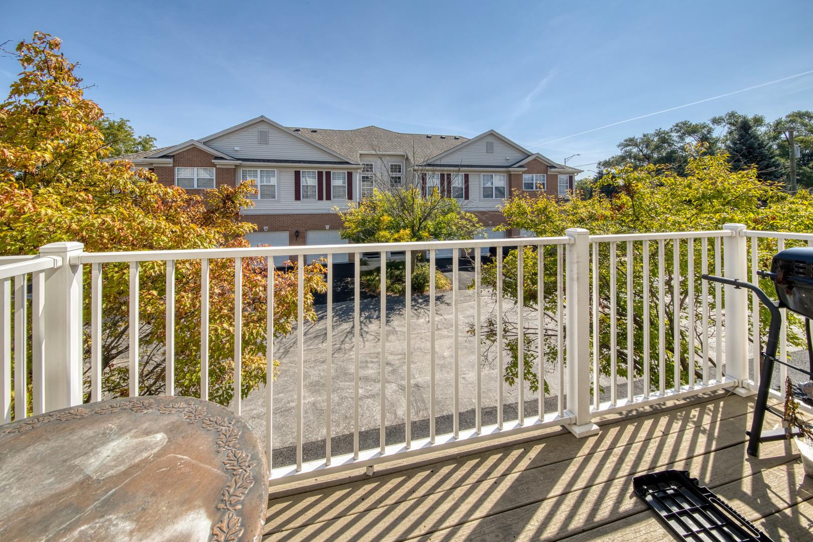 10233 Concord Lane, Unit C Bridgeview, IL 60455 - Photo 19 of 20 a view of a balcony with wooden floor and city view