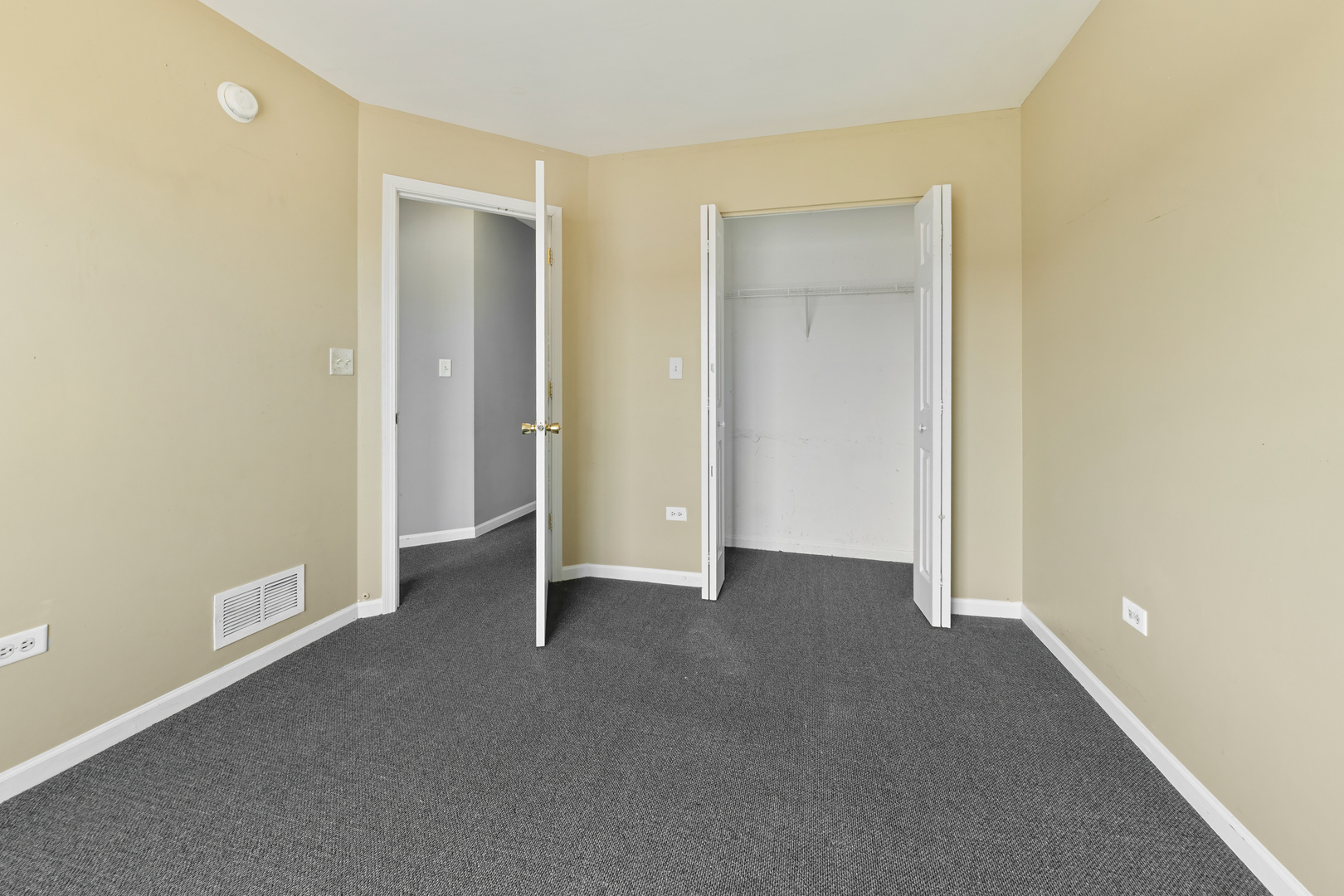 10233 Concord Lane, Unit C Bridgeview, IL 60455 - Photo 8 of 20 a view of an empty room with closet and a window