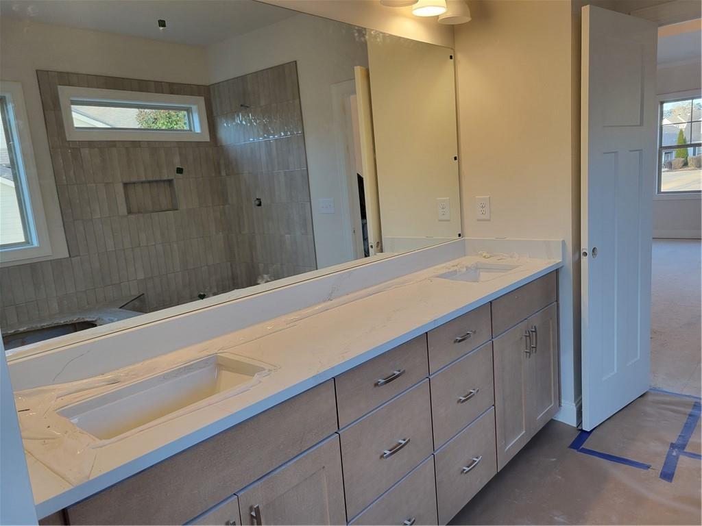 4795 Fairways Lane Jefferson, GA 30549 - Photo 9 of 20 a bathroom with a sink and a mirror