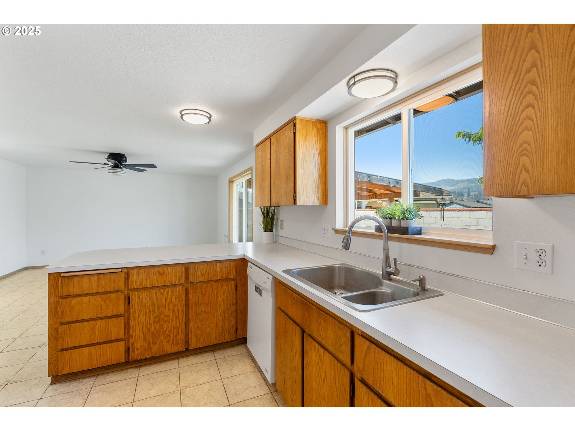 3196 Midway Road Hood River, OR 97031 - Photo 15 of 44 a kitchen with a sink a counter top space and cabinets