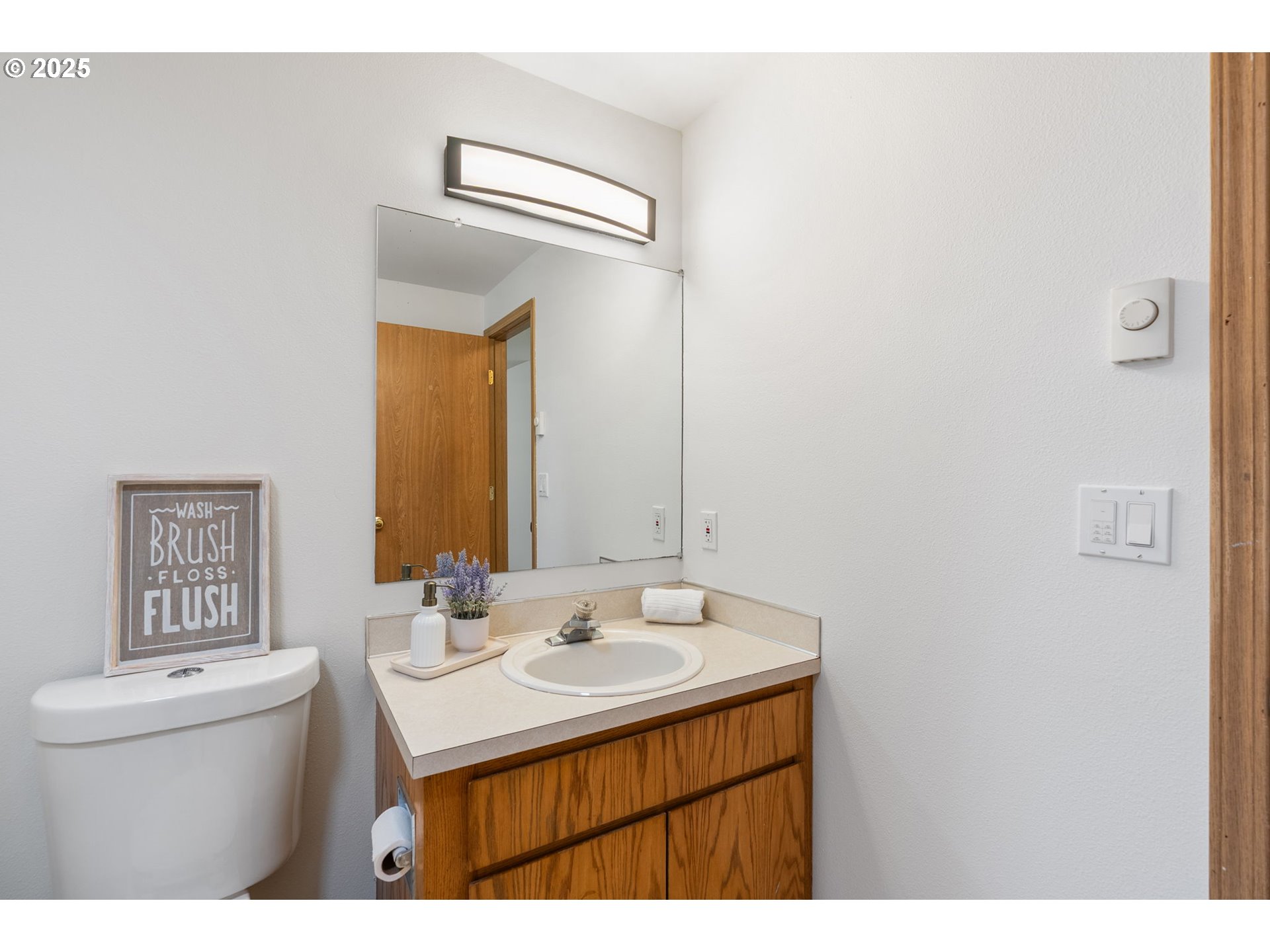 3196 Midway Road Hood River, OR 97031 - Photo 18 of 44 a bathroom with a sink mirror vanity and toilet
