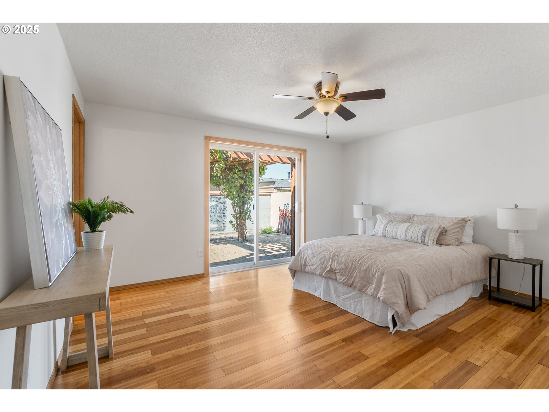 3196 Midway Road Hood River, OR 97031 - Photo 22 of 44 a bedroom with a bed chandelier and a window