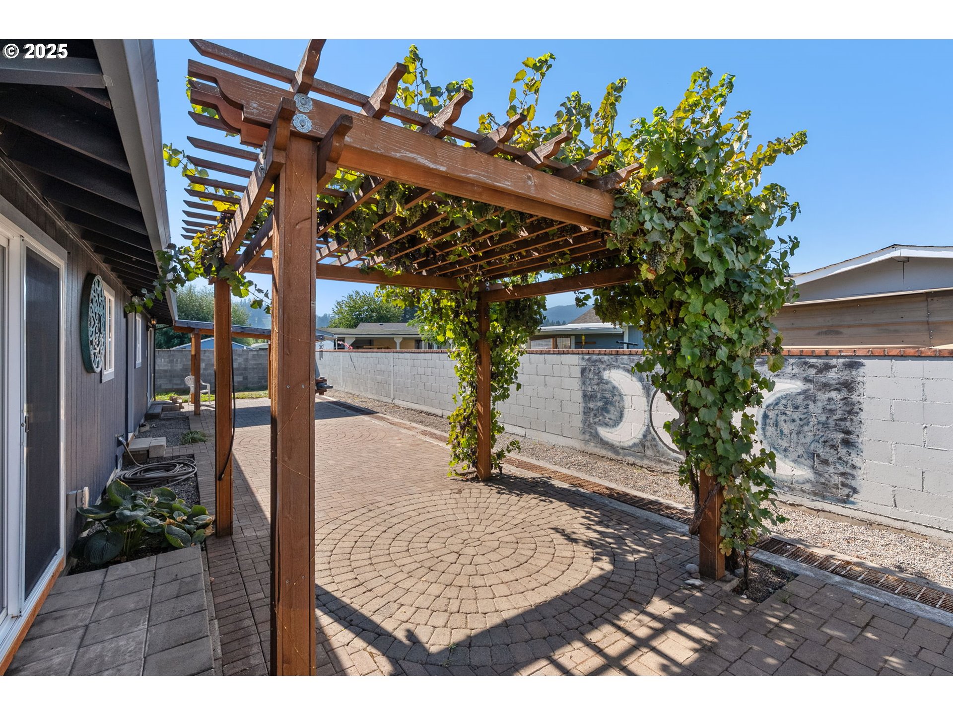 3196 Midway Road Hood River, OR 97031 - Photo 38 of 44 a picture of a tree in front of a house