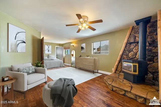 an entryway with wooden floor and cabinet
