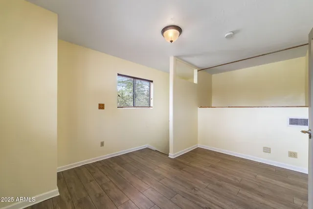 a bathroom with a double vanity sink mirror and toilet