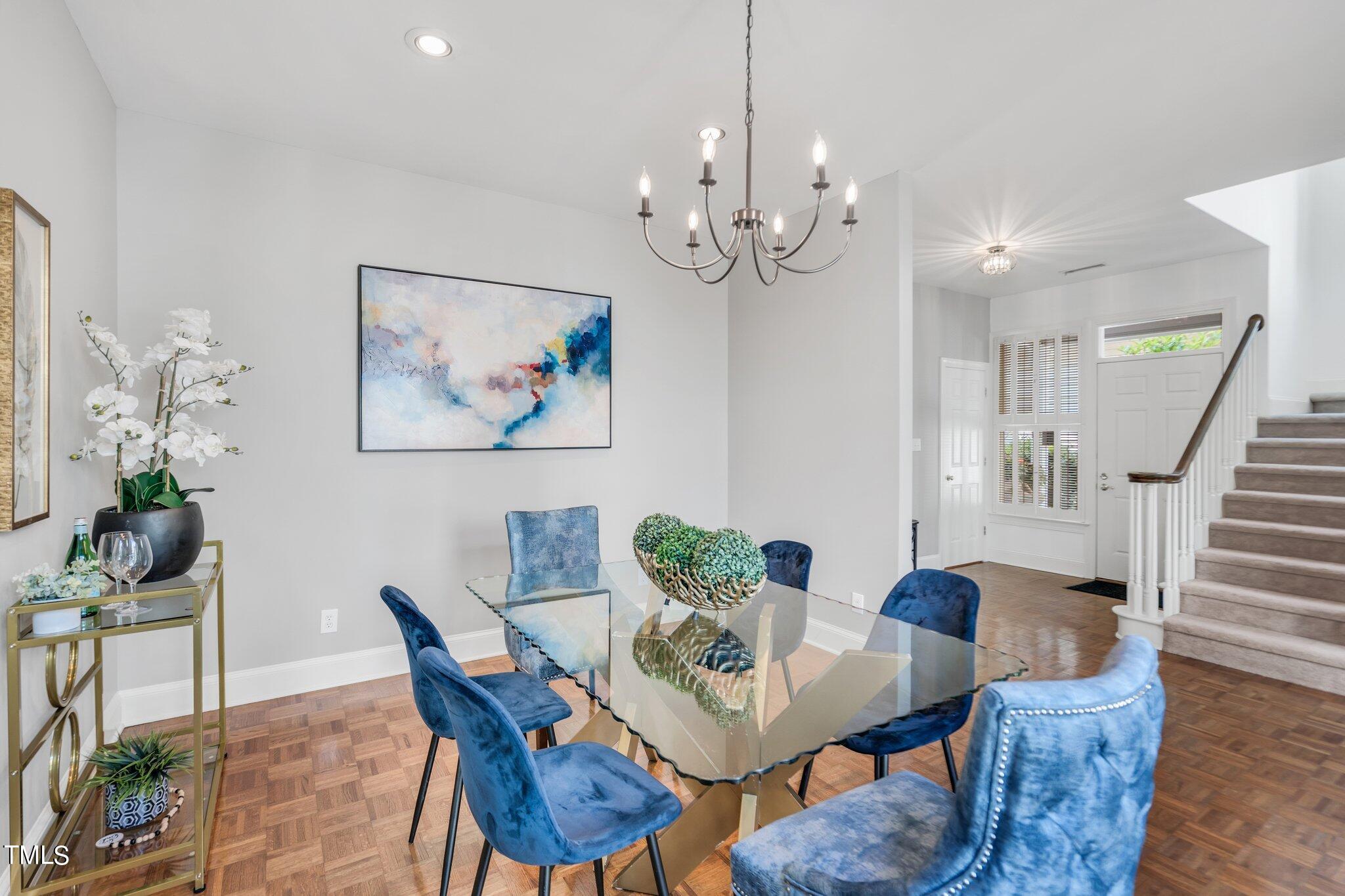 25 East Camden Pittsboro, NC 27312 - Photo 13 of 71 a view of a dining room with furniture wooden floor and a chandelier