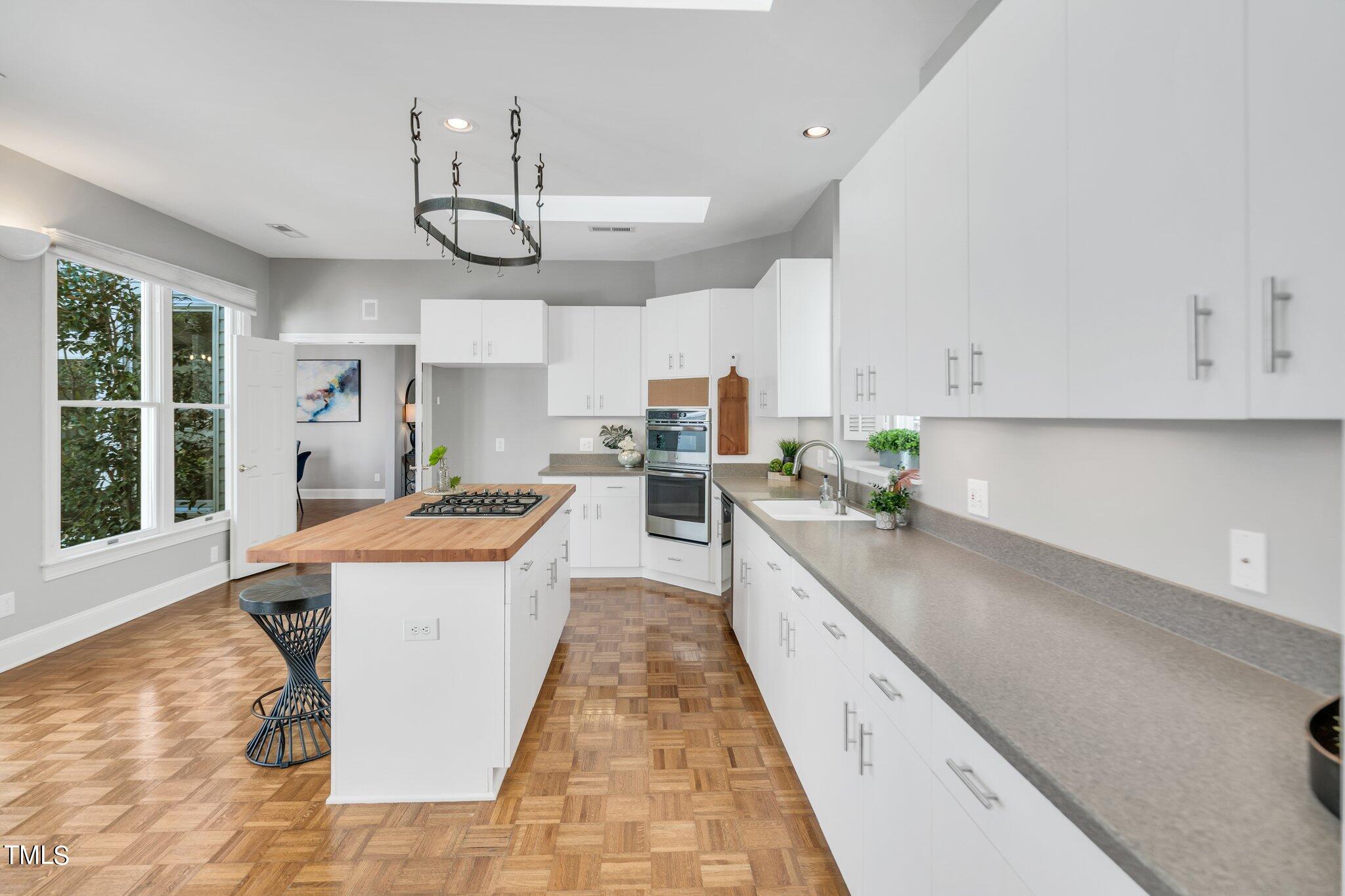 25 East Camden Pittsboro, NC 27312 - Photo 20 of 71 a large kitchen with stainless steel appliances granite countertop a sink and cabinets