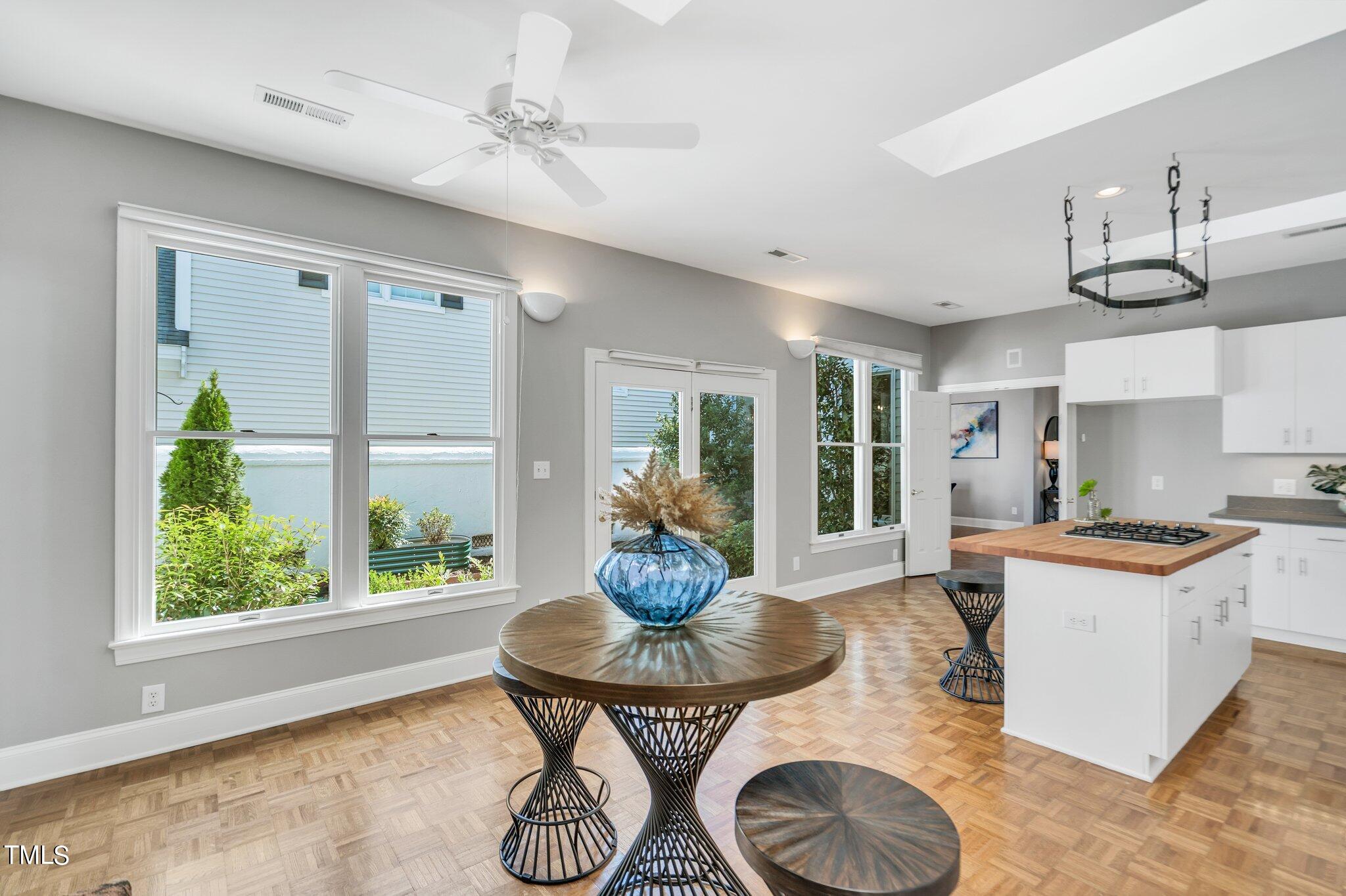 25 East Camden Pittsboro, NC 27312 - Photo 23 of 71 a living room with kitchen island furniture and a large window