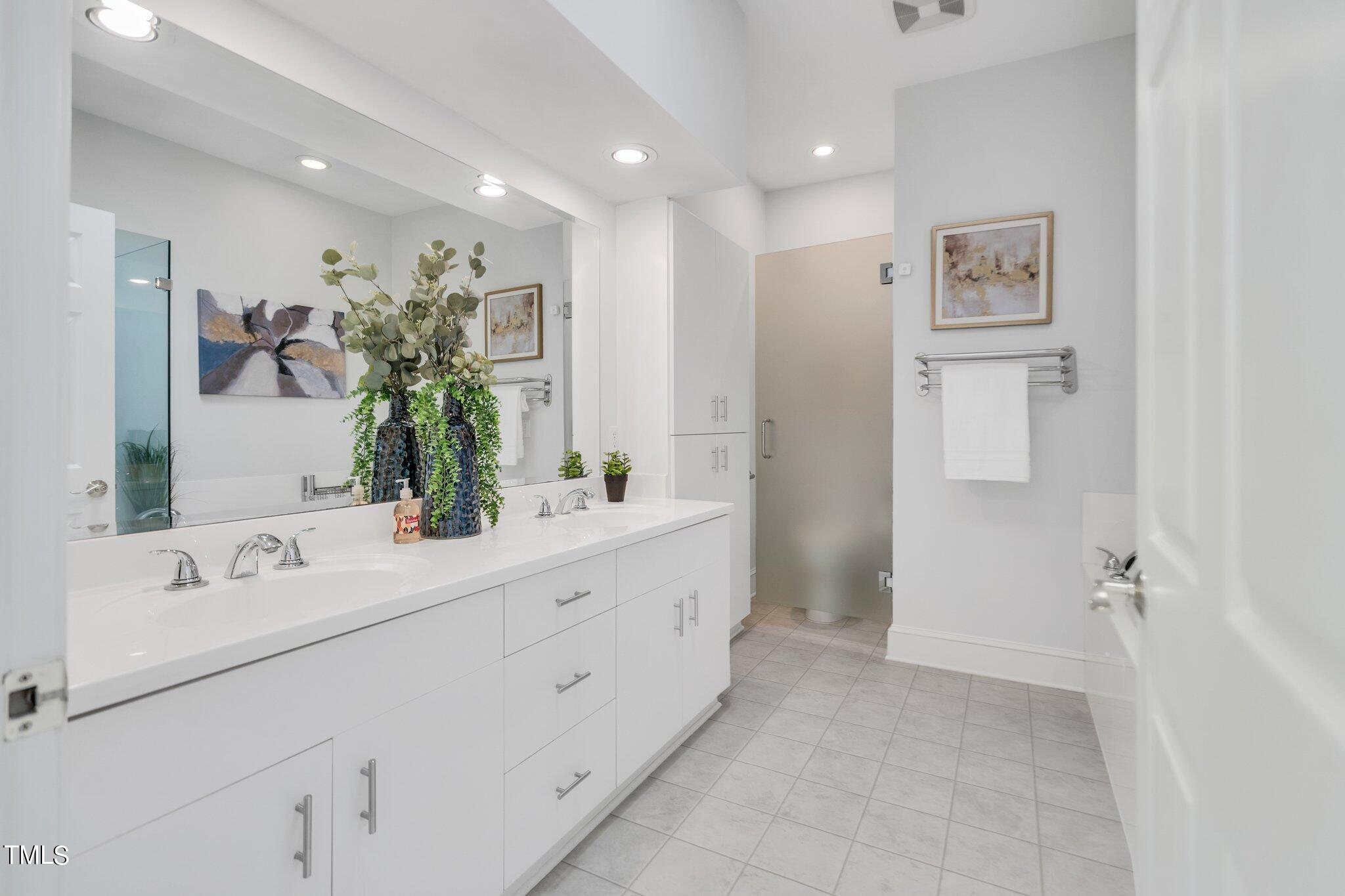 25 East Camden Pittsboro, NC 27312 - Photo 36 of 71 a spacious bathroom with a double vanity sink and a mirror