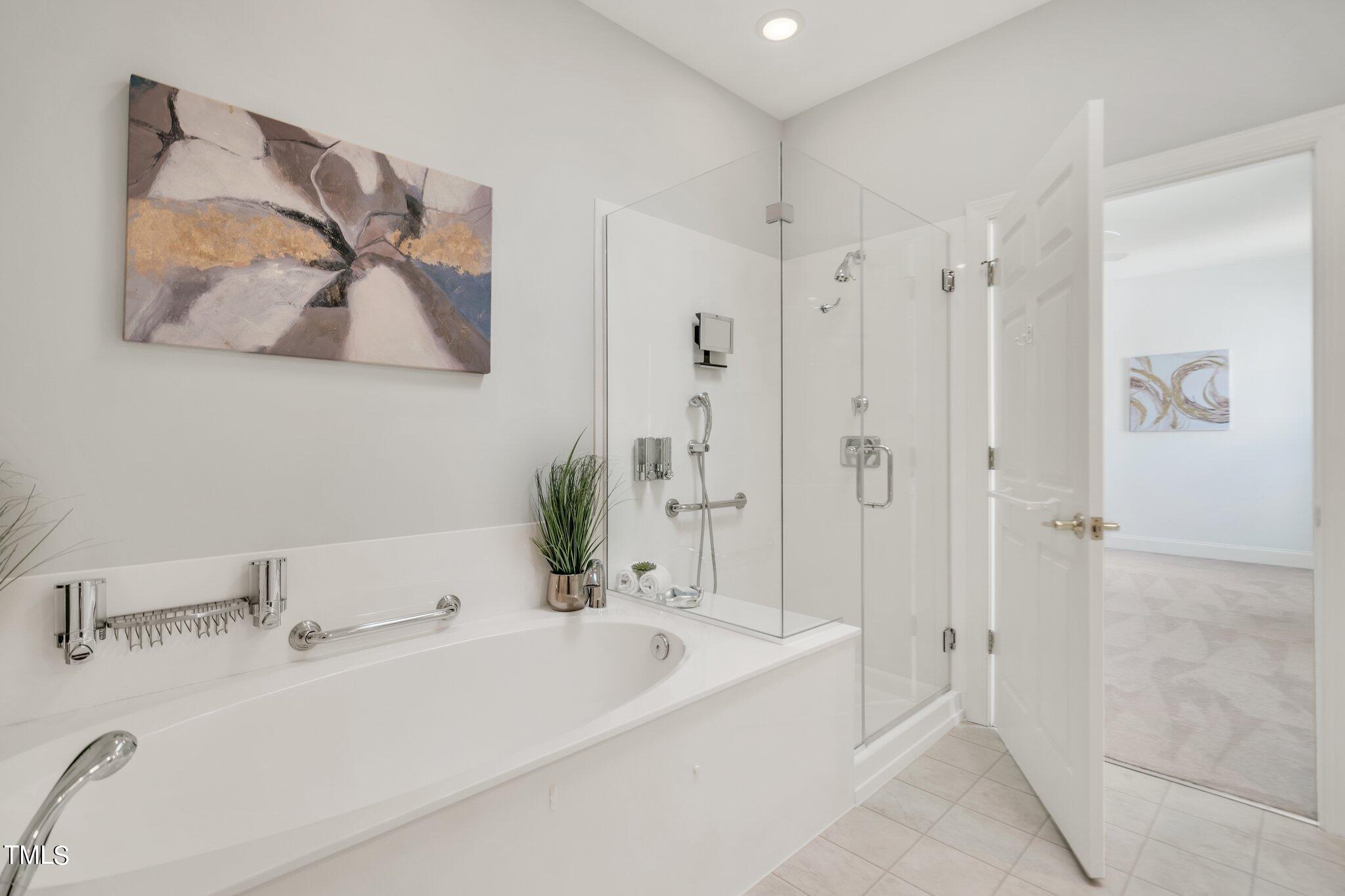 25 East Camden Pittsboro, NC 27312 - Photo 37 of 71 a bathroom with a tub a sink and mirror