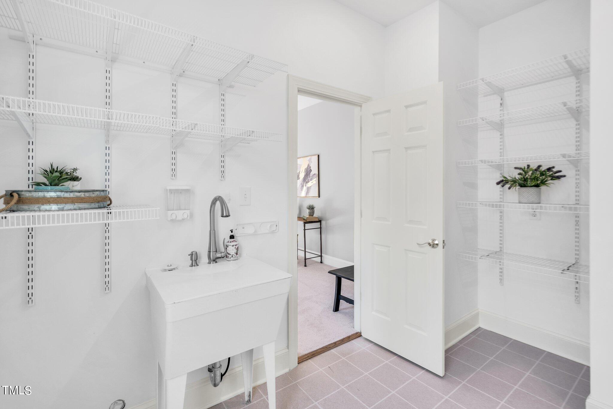 25 East Camden Pittsboro, NC 27312 - Photo 42 of 71 a bathroom with a sink a mirror and shower