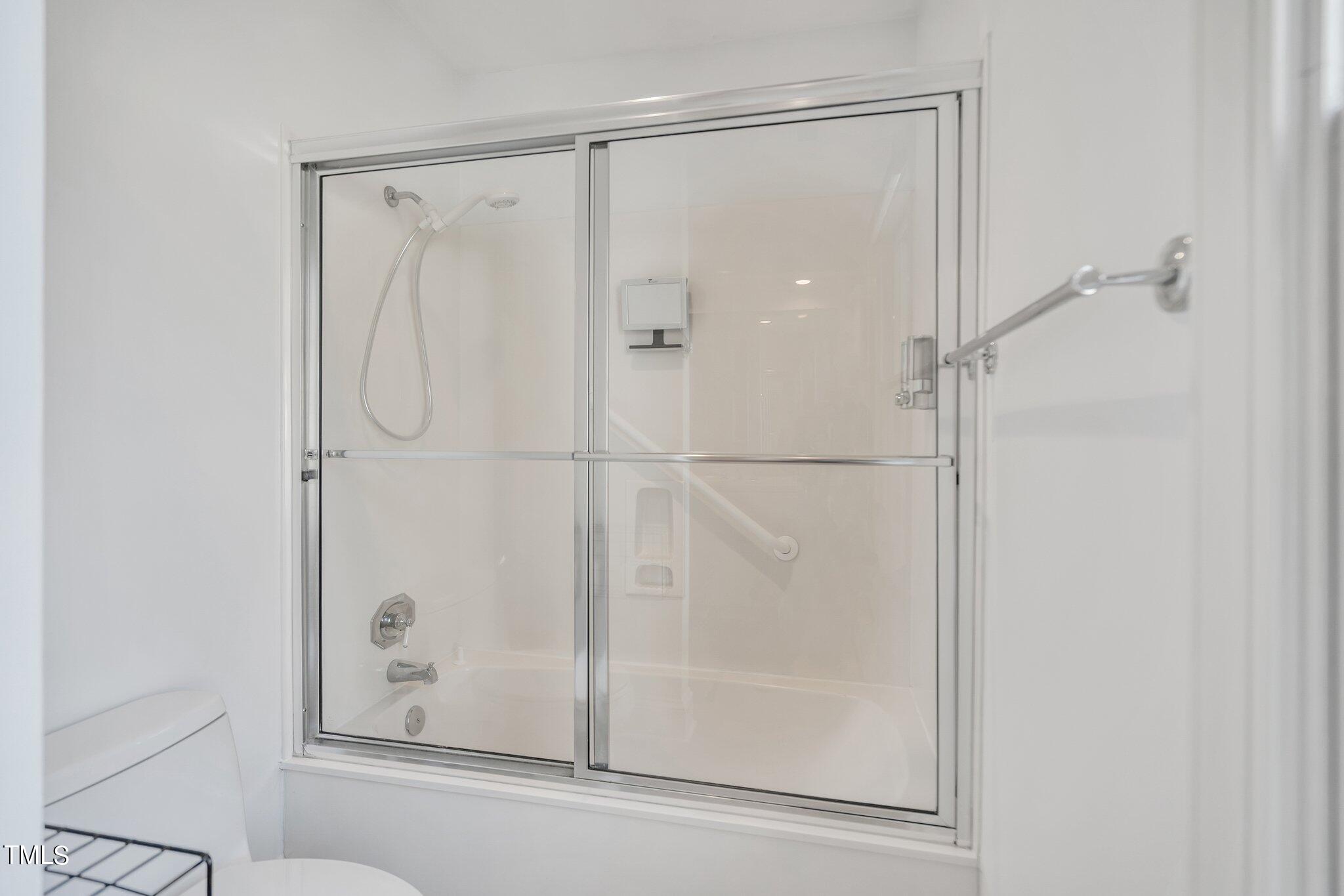 25 East Camden Pittsboro, NC 27312 - Photo 47 of 71 a bathroom with a glass shower door