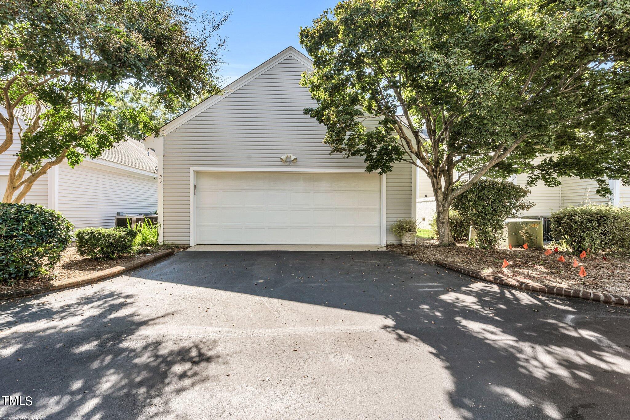 25 East Camden Pittsboro, NC 27312 - Photo 58 of 71 a front view of a house with a yard and garage