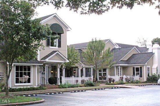 25 East Camden Pittsboro, NC 27312 - Photo 65 of 71 a front view of a residential apartment building with a yard