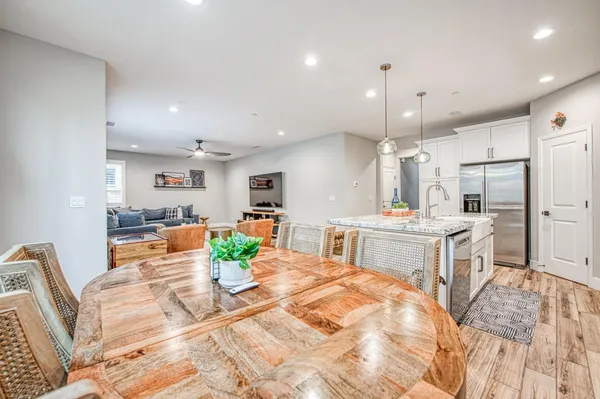 a stove top oven sitting inside of a kitchen