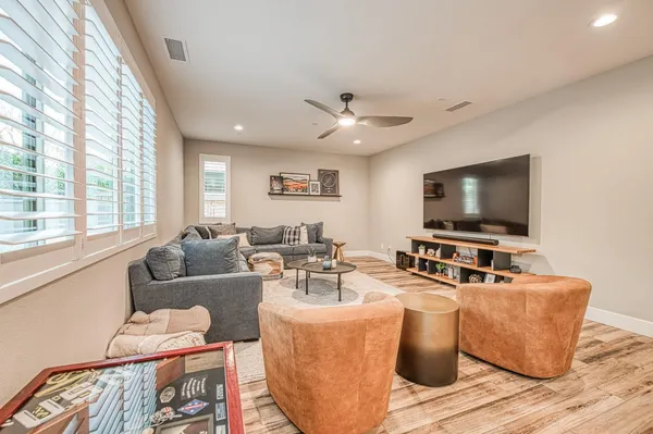 a living room with furniture and a large window
