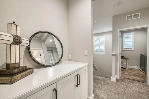 a bathroom with a granite countertop sink toilet mirror and shower