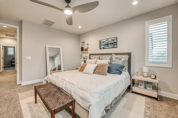 a bathroom with a double vanity sink a mirror and a shower