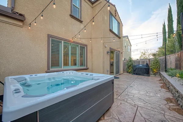 an aerial view of a residential houses with outdoor space
