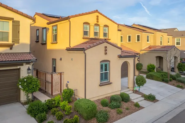 an aerial view of a house with a garden